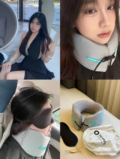 Soft memory foam travel pillow designed for comfort and neck support during long trips, placed next to a suitcase.